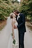 bride and groom kissing in the middle of the road- Hawke's Bay Weddding