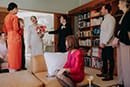 bride and groom greeted by their family members seeing for the first time with their wedding dress and suit- Waikanae Wedding