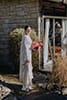 bride standing lovingly with her bridal dress and florals- Waikanae Wedding