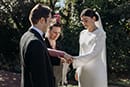 bride and groom in their wedding ceremony putting their wedding rings- Waikanae Wedding