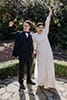 bride and groom happily cheering as newly weds- Waikanae Wedding