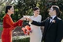 bride and groom having a toast with the bride's sister- Waikanae Wedding