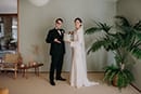 bride and groom with their wedding cake made by the bride herself- Waikanae Wedding