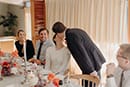 bride and groom sharing a sweet kiss in their wedding reception- Waikanae Wedding