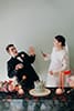 bride and groom in their funny pose as they slice their wedding cake- Waikanae Wedding 