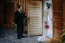 bride and groom walking outside their wedding venue- Waikanae Wedding