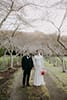 bride and groom standing in the middle of the road- Waikanae Wedding