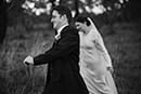 bride and groom walking in the middle of the forest- Waikanae Wedding