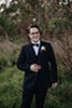 groom smiling in the middle of the forest- Waikanae Wedding