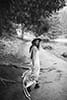 bride looking back while walking in the wonders of nature- New Zealand Elopements