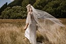 bride walking as the cold breeze pass by her- New Zealand Elopements