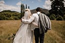 bride and groom walking down together- New Zealand Elopements