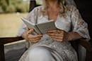 bride reading while waiting for her wedding ceremony- New Zealand Elopements