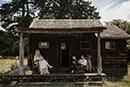 bride and groom sitting lovingly in the country house- New Zealand Elopements