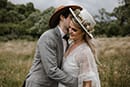 bride and groom hugging in the middle of the mountains- New Zealand Elopements