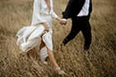 bride and groom walking as the cold breeze pass by them- New Zealand Elopements