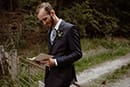 groom reading his bride letter for him- New Zealand Elopements