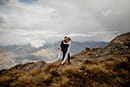 bride and groom in the middle of the beautiful mountains- New Zealand Elopements